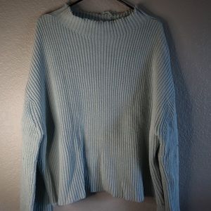 Bare knuckles inspired cropped sweater